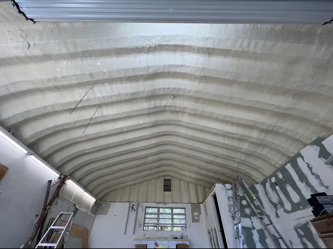 Spray polyurethane foam applied to the underside of a metal roof deck in Farmingdale